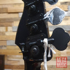 Fender Duff McKagan Deluxe P Bass in black with a rosewood fretboard, showcasing its sleek design and hardware.
