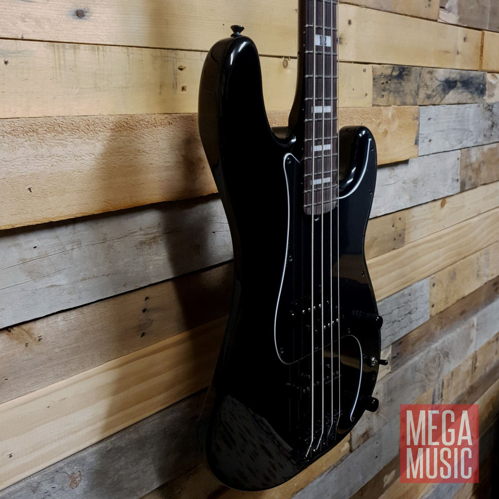 Fender Duff McKagan Deluxe P Bass in black with rosewood fretboard, showcasing its sleek design and hardware details.