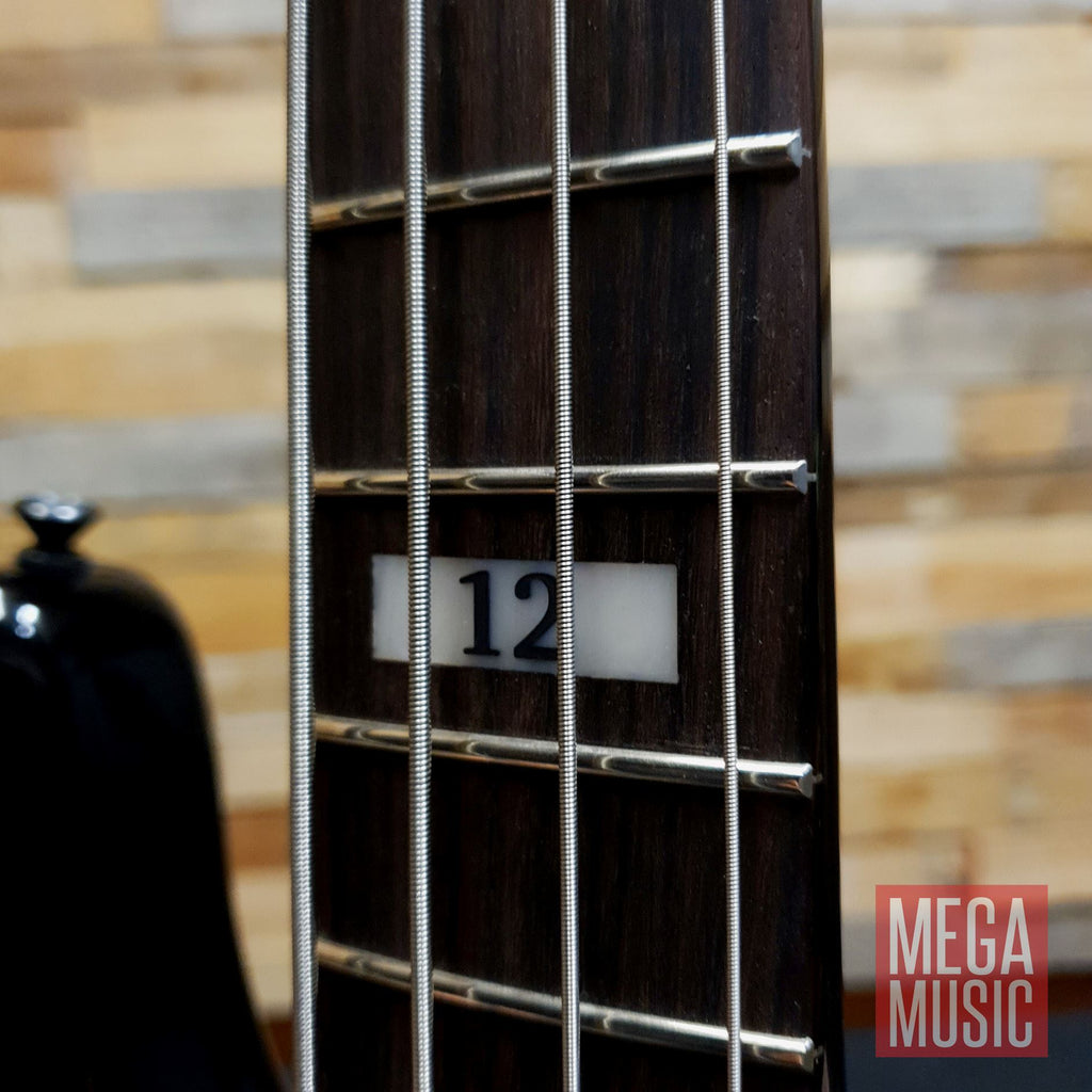 Fender Duff McKagan Deluxe P Bass in black with rosewood fretboard, showcasing the body and neck details.