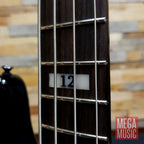 Fender Duff McKagan Deluxe P Bass in black with rosewood fretboard, showcasing the body and neck details.