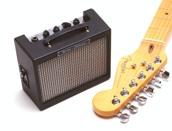 Fender MD20 Mini Deluxe Guitar Amplifier in black, compact electric guitar amp with control knobs and speaker grille.
