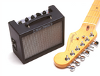 Fender MD20 Mini Deluxe Guitar Amplifier in black, compact electric guitar amp with control knobs and speaker grille.