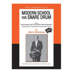 Open page from Modern School for Snare Drum book by Morris Goldenberg, showcasing drum notation and instructional content.