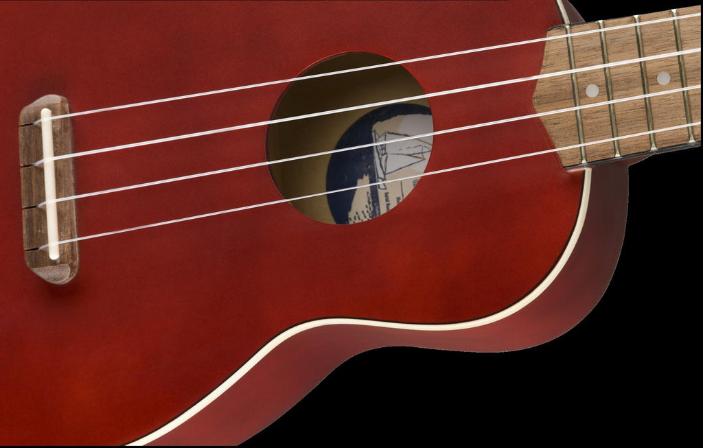 Fender Venice Soprano Ukulele with cherry finish and walnut fingerboard, showcasing the compact ukulele and its wood details.