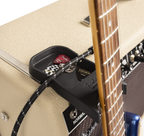 Fender Amperstand™ black guitar cradle holding an electric guitar, designed for secure storage and display of guitars.