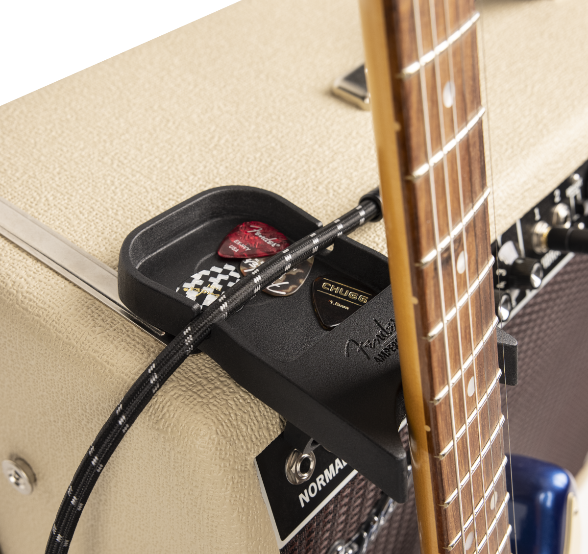 Fender Amperstand™ black guitar cradle holding an electric guitar, designed for secure storage and display of guitars.