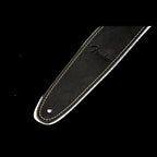 Black Fender leather guitar strap with adjustable length and padded shoulder for comfortable playing.