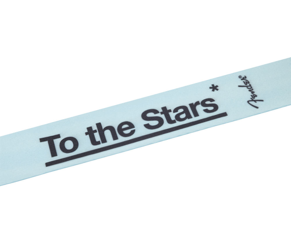 Fender Tom DeLonge To The Stars Daphne Blue guitar strap with adjustable strap ends and star logo design.