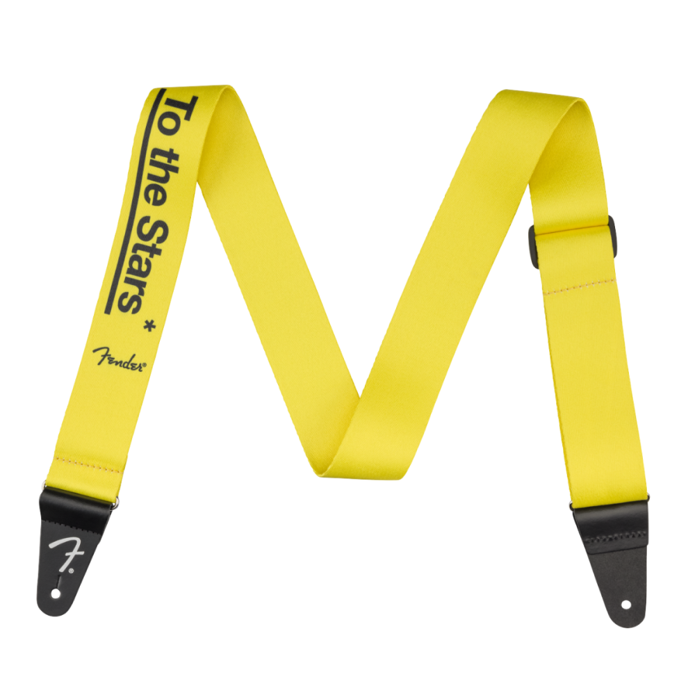 Fender Tom DeLonge To The Stars guitar strap in graffiti yellow with black star design, adjustable strap for electric guitars.