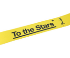 Fender Tom DeLonge To The Stars guitar strap in graffiti yellow with black star design, adjustable strap for electric guitars.