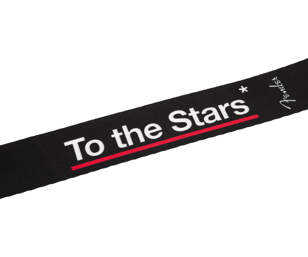 Fender Tom DeLonge To The Stars black guitar strap with adjustable leather ends, designed for electric guitars.