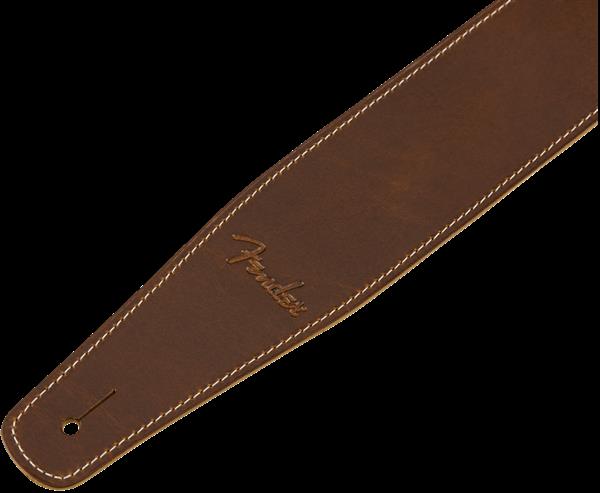 Fender Broken-In Leather 2.5-inch tan guitar strap showing textured leather and adjustable strap ends for comfortable playing.