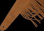 Fender suede fringe guitar strap with leather ends and decorative fringes, designed for comfortable and stylish guitar wearing.