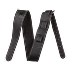 Black Fender Monogram Leather Guitar Strap with embossed logo, adjustable strap for comfortable guitar playing.