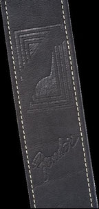 Fender Monogram Leather Guitar Strap in black, featuring embossed branding and adjustable leather design for comfortable playing.