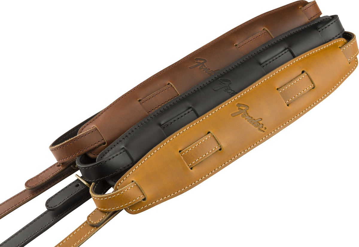 Fender Vintage Saddle guitar strap in butterscotch with leather ends and adjustable length, designed for acoustic and electric guitars.