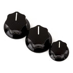 Set of three black Fender Jazz Bass knobs, two large and one small, for guitar control replacement or upgrade.