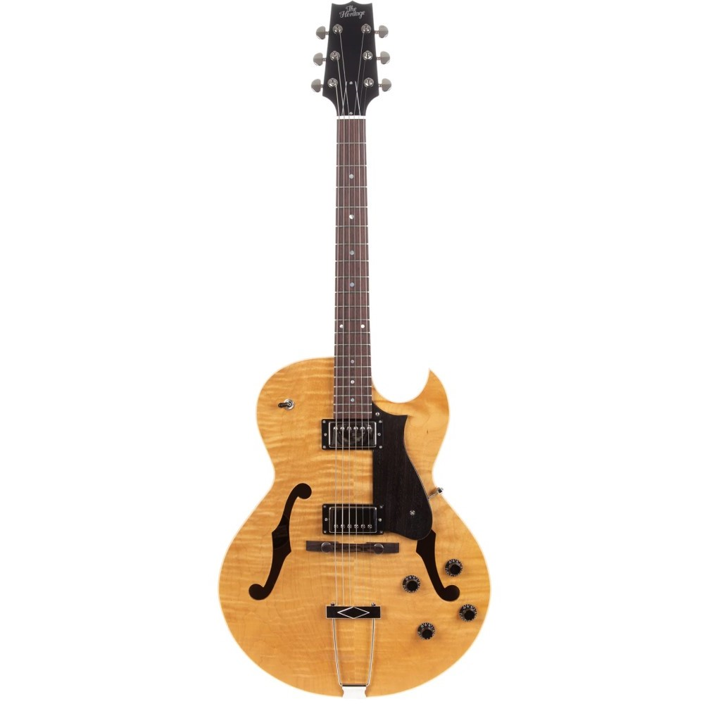 Heritage Standard H-575 hollow electric guitar in antique natural finish, showing its body, neck, and hardware details.