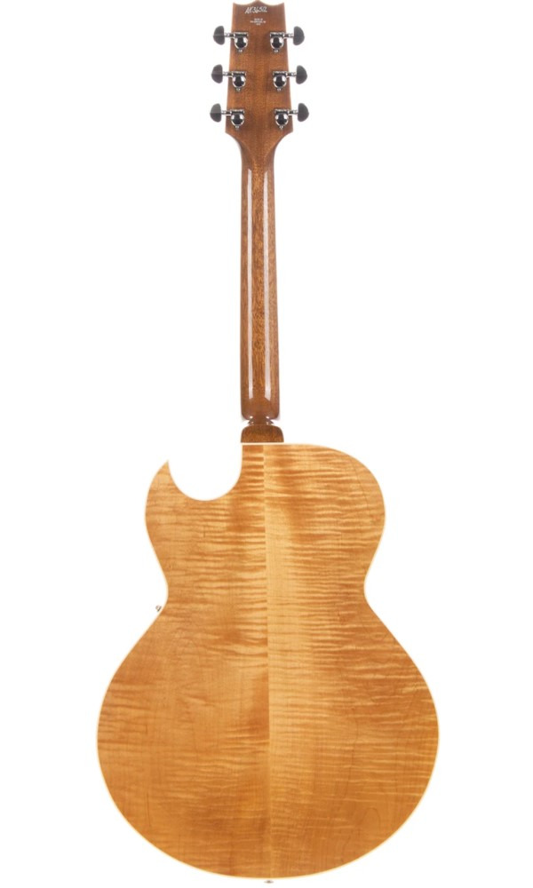 Heritage Standard H-575 hollow electric guitar in antique natural finish, showing the body and neck details.