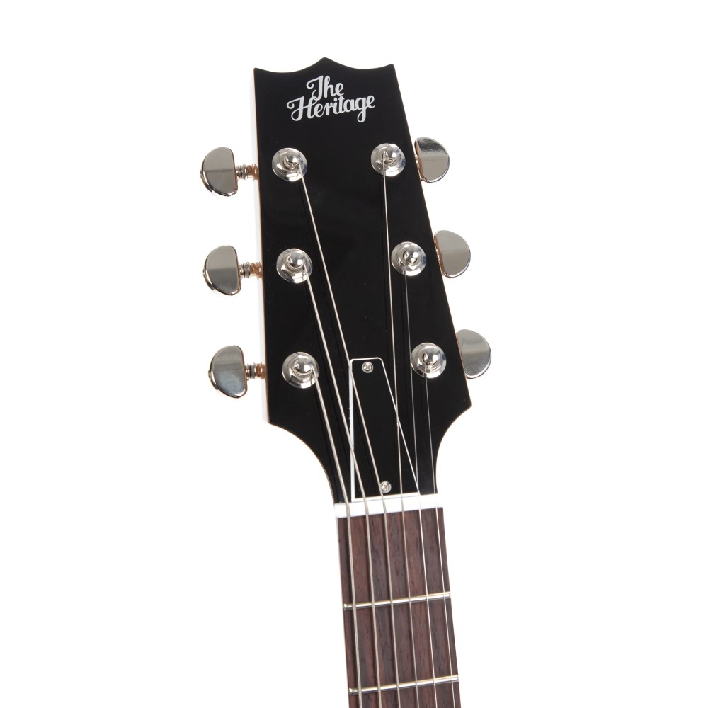 Heritage Standard H-575 hollow electric guitar in antique natural finish, with sunburst body and vintage-style hardware.