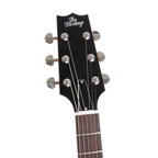 Heritage Standard H-575 hollow electric guitar in antique natural finish, with sunburst body and vintage-style hardware.