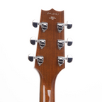 Heritage Standard H-575 hollow electric guitar in antique natural finish, showing the body and neck with detailed wood grain.