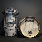 Sonor SQ2 drum kit with white oyster finish, medium beech shells, including 12x9 tom, 14x6 snare, 14x14 floor, and 20x16 bass drums.