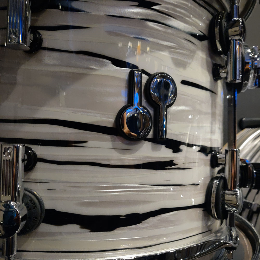 Sonor SQ2 drum kit in white oyster finish with medium beech shells, including 12x9 tom, 14x6 snare, 14x14 floor, and 20x16 bass drums.
