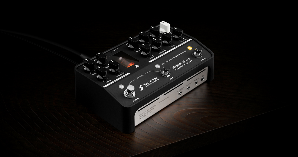 TWONOTES Two Notes Revolt Bass 3-channel pedal-format bass amplifier with control knobs and input/output jacks visible.