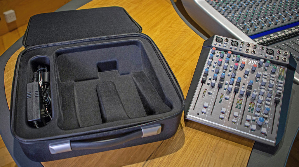 Solid State Logic Six carry case for rack gear, featuring a sleek design and durable exterior for protection.