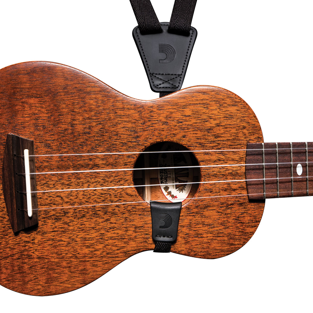 Black 19mm D'Addario ukulele strap with adjustable length, designed for comfortable support during playing.