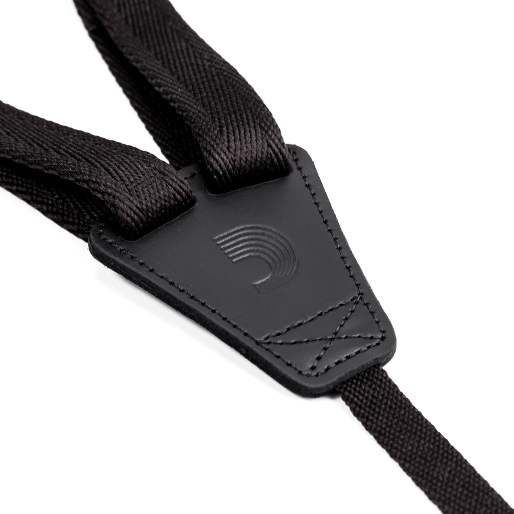 Black 19mm D'Addario ukulele strap with adjustable length, designed for comfortable playing and secure fit.