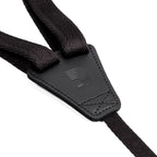 Black 19mm D'Addario ukulele strap with adjustable length, designed for comfortable playing and secure fit.