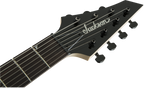 Jackson JS22-7 Dinky 7-string electric guitar with glossy black finish and amaranth fingerboard, showcasing its sleek design and hardware.