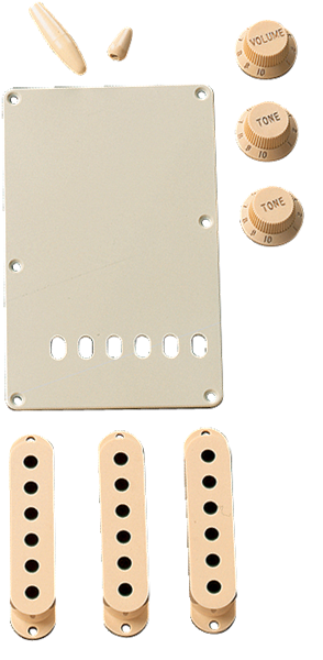 Fender accessory kit for Stratocaster guitar in aged white includes parts like knobs and switches, designed for guitar customization.