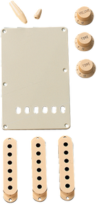 Fender accessory kit for Stratocaster guitar in aged white includes parts like knobs and switches, designed for guitar customization.