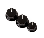 Fender Jazz Bass knobs set with two large and one small black control knobs for guitar volume and tone adjustment.