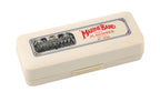 Hohner Marine Band 1896 Classic Harmonica in key of C with metal cover plates and wooden comb, placed on a wooden surface