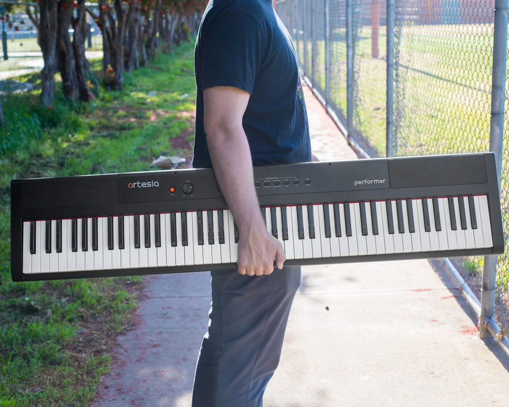 Artesia Pro Performer portable digital piano in black with full-sized keys and control panel, ideal for musicians on the go.