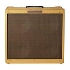 Fender 59 Bassman guitar amplifier with vintage-style control knobs and classic black tolex exterior, on a wooden surface.