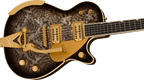 Gretsch G6134TG Limited Edition Penguin electric guitar in black paisley finish with chrome hardware and unique body shape.