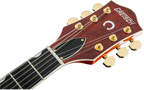Gretsch G6120T Players Edition Nashville electric guitar in orange stain with double-cutaway body and vintage-style hardware.