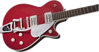 Gretsch G6129T Players Edition Jet FT electric guitar with red sparkle finish and rosewood fretboard, showcasing its body and hardware.