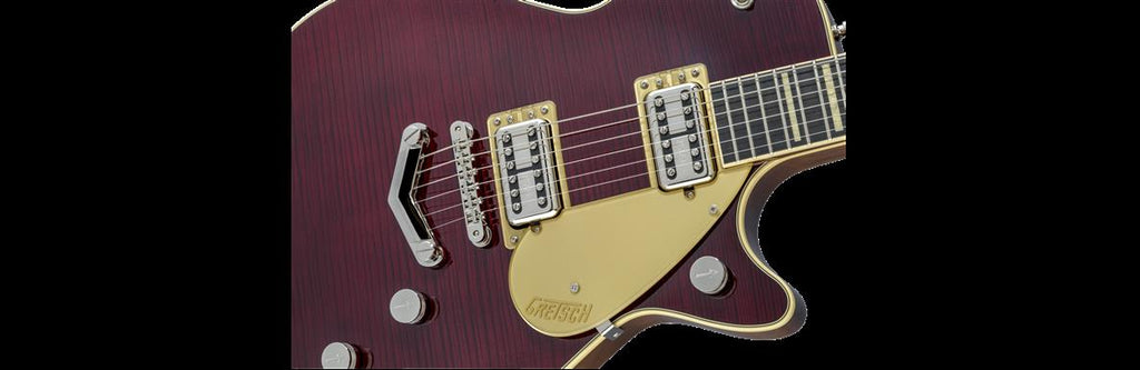 Gretsch G6228FM-PE Duo Jet V-Stoptail electric guitar with dark cherry stain flame top, showcasing its sleek body and dual pickups.