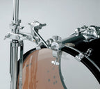 Tama MHA623 Hi Hat to Bass drum attachment for drum hardware, shown attached to a drum set in a music studio setting.
