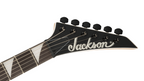 Jackson JS Series Dinky JS20 DKQ electric guitar in transparent green burst with a sleek body and dual pickups.