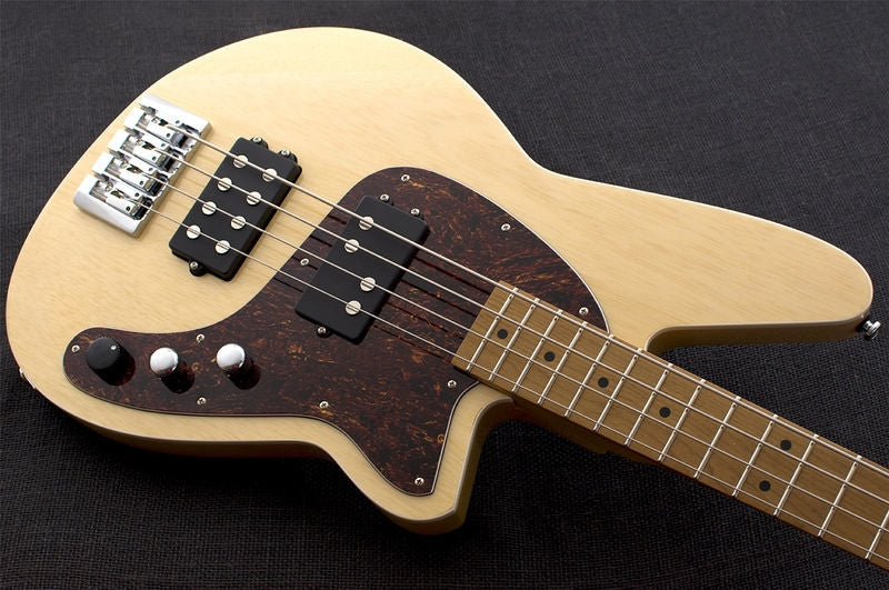 Reverend Mercalli 4 bass guitar in natural wood finish, showing the body, neck, and strings on a plain background.