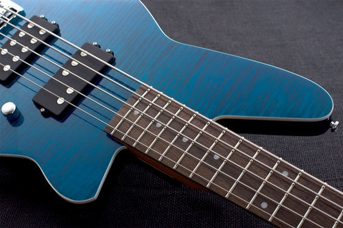 Reverend Mercalli 5 FM bass guitar in vibrant trans turquoise color, featuring a sleek body and four-string design.