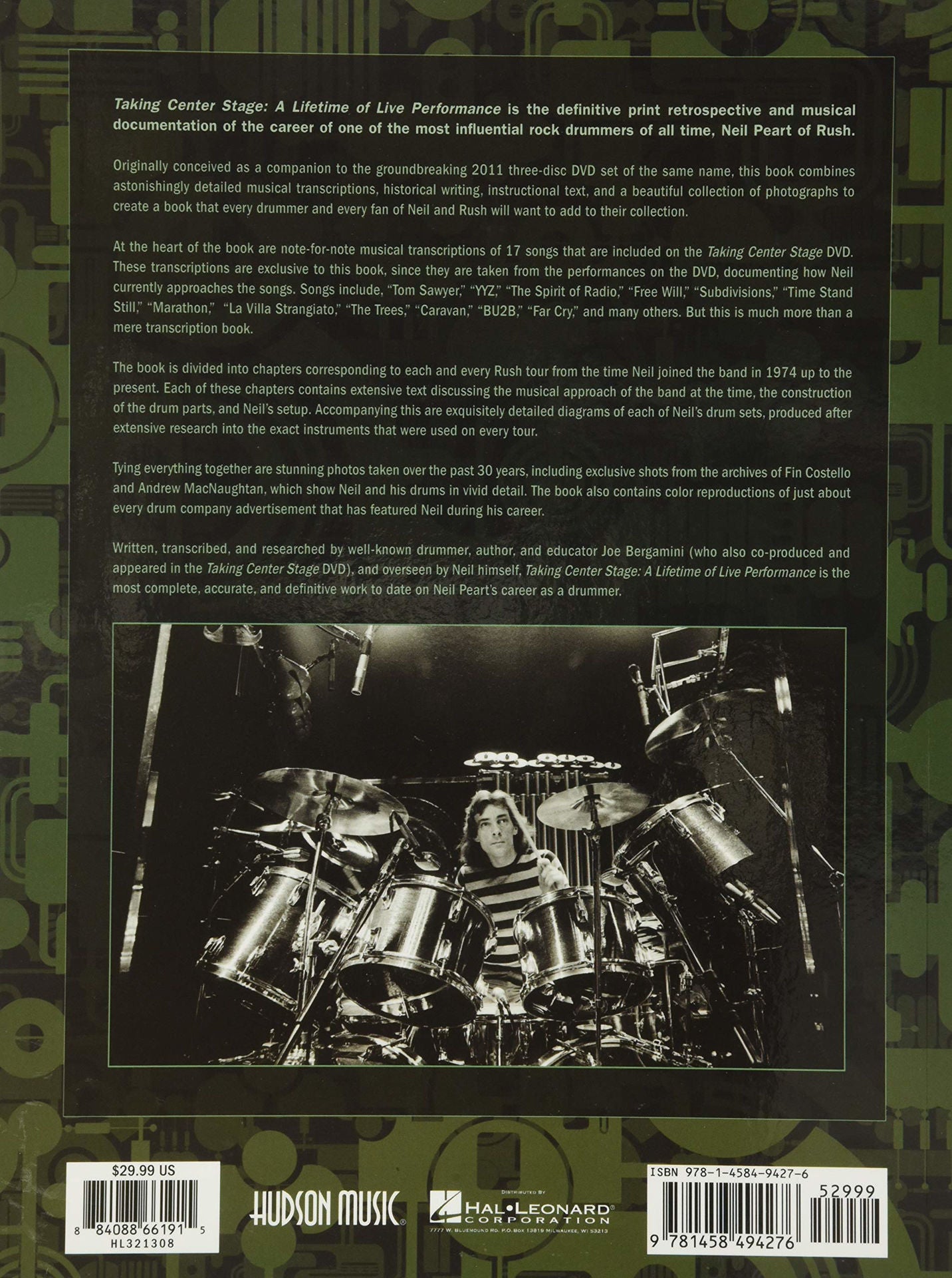 Open book titled "Taking Centre Stage" by Neil Peart, featuring images and text about his lifetime of live drumming performances.
