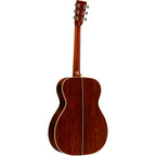 Martin 000-EC Eric Clapton 30th Anniversary acoustic guitar with a natural wood finish and detailed inlay, featuring a cutaway body.
